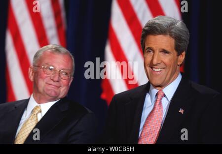 Presidential hopeful Sen. John Kerry, D-MA, has a laugh with  former-Chairman of the Joint Chiefs of Staff Gen. John Shalikashvili prior to speaking at a campaign event at the George Washington University on March 17, 2004 in Washington.  The event was to announce that if elected, Kerry would veteran's bill of rights for all those in the U.S. military. (UPI Photo/Michael Kleinfeld) Stock Photo