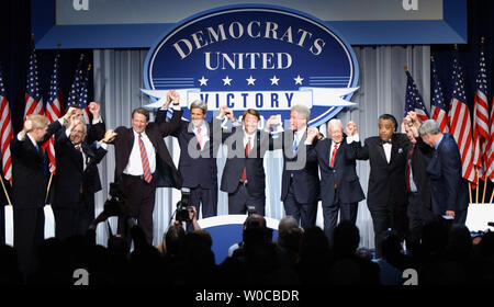 Democratic presidential candidate John Kerry takes the stage at a Democratic National Committee fundraiser on March 25, 2004, in Washington. The event was expected to raise over 11 million dollars. From left to right are Rep. Richard Gephardt, D-Mo., Wesley Clark, Sen. Joseph Lieberman, D-Conn., Democratic National Committee Chairman Terry McAuliffe, former Vice President Al Gore, Democratic presidential candidate Sen. John Kerry, D-Mass., Sen. John Edwards, D-N.C., former President Bill Clinton , former President Jimmy Carter, Rev. Al Sharpton, former Vermont Gov. Howard Dean, and Sen. Bob Gr Stock Photo