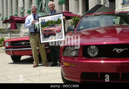 Jim O'Conner holds a picture of a stamp celebrating the 40th anniversary of the 1965 Ford Convertible Mustang along with an owner of an original model of the later 1965 Convertible Mustang David Williams at the National Postal Museum in Washington on June 2, 2004. (UPI Photo/Arianne Starnes) Stock Photo