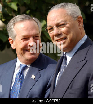 Secretary of State Colin Powell (R) and Secretary of Commerce Don Evans listen to the remarks of President George W. Bush during signing ceremony of the US-Australia Free Trade Agreement Implementation Act on Aug. 3, 2004, in the Rose Garden of the White House.     (UPI Photo/Roger L. Wollenberg) Stock Photo