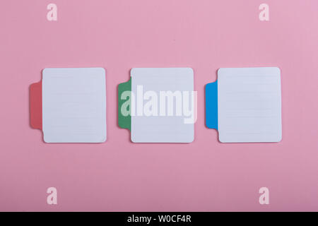 Many colorful sticky note on pink background. Copy space Stock Photo