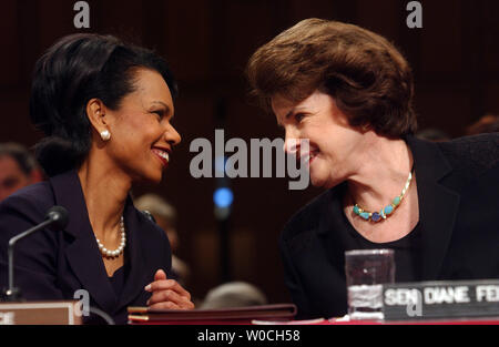 Nominee for Secretary of State, Condoleezza Rice, left, speaks with Sen. Dianne Feinstein, D-CA, prior to testifing before the Senate Foreign Relations Committee for her nomination hearing, on January 18, 2005 in Washington.  Rice is expected to get the needed votes to officially make her Secretary of State.  She formerly served as President George W. Bush's National Security Advisor.  (UPI Photo/Michael Kleinfeld) Stock Photo