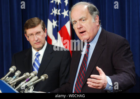 Rep. John Spratt, D-SC, speaks to members of the press during a news conference regarding the new CBO budget deficit projections, on January 25, 2005, as Sen. Kent Conrad, D-ND, looks on.  Conrad attacked President Bush's tax cuts and spending in Iraq and Afghanistan for the high increases in the U.S. national deficit. (UPI Photo/Michael Kleinfeld) Stock Photo