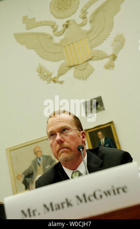 Former Major League Baseball player Mark McGwire testifies before the House Committee on Government Reform about the use of steroids in Major League Baseball on March 17, 2005 in Washington.  MLB has come under major criticism for what is said to be rampant use of steroids by their players. In his opening statement, McGwire said he would not testify against friends or incriminate himself.   (UPI Photo/Michael Kleinfeld) Stock Photo