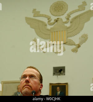 Former Major League Baseball player Mark McGwire testifies before the House Committee on Government Reform about the use of steroids in Major League Baseball on March 17, 2005 in Washington.  MLB has come under major criticism for what is said to be rampant use of steroids by their players. In his opening statement, McGwire said he would not testify against friends or incriminate himself.   (UPI Photo/Michael Kleinfeld) Stock Photo