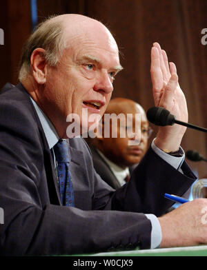 Treasury Secretary John Snow testifies before the Senate Banking, Housing and Urban Affairs Committee regarding 'Regulatory Reform of the Government  Sponsored Enterprises' on April 7, 2005 in Washington.  Snow discussed current housIng trends and how they are effecting the economy.  HUD Secretary Alphonso Jackson looks on.  (UPI Photo/Michael Kleinfeld) Stock Photo