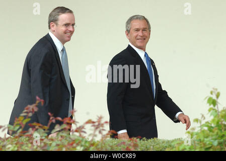 U.S. President George W. Bush walks with Dan Bartlett, advisor to the President, in the Rose Garden of the White House after returning from a trip to South Carolina on April 18, 2005. Bush visited Columbia, SC, to discuss Social Security.   (UPI Photo/Roger L. Wollenberg)