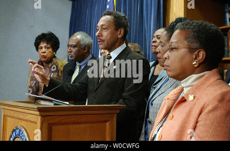 Congressional Black Caucus chairman Rep. Melvin Watt, D-N.C., backed by members of the caucus, voices the group's opposition to Supreme Court Justice nominee Samuel Alito during a news conference on Capitol Hill in Washington on December 8, 2005.   (UPI Photo/Roger L. Wollenberg) Stock Photo