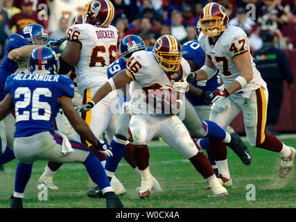 Washington Redskins' Clinton Portis runs against New York Giants' Will  Allen, during the fourth quarter at FedEx Field in Landover, Maryland, on  December 24, 2005. This was Portis's eight game this season