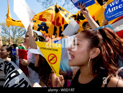 Estefani Pierola, 15, of Annandale, Va., cheers, 'USA, USA' before the start of the march at Meridian Hill Park in Washington on April 10, 2006.  Tens of thousands of immigrants and their supporters rallied today against a House bill that would criminalize illegal immigrants and for reform measures that would protect their rights.  (UPI Photo/Chris Rossi) Stock Photo
