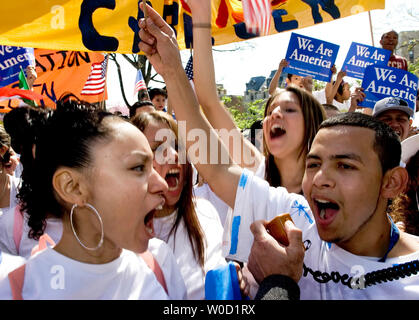 Abidail Estrada, 18, of Woodbridge, Va., (right) chants with fellow protesters before leaving Meridian Hill Park to march to the National Mall in Washington on April 10, 2006..  Tens of thousands of immigrants and their supporters rallied today against a House bill that would criminalize illegal immigrants and for reform measures that would protect their rights.  (UPI Photo/Chris Rossi) Stock Photo
