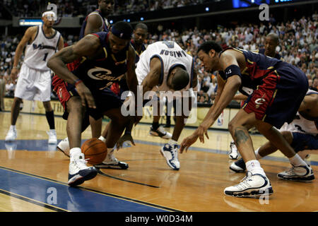 Cleveland Cavaliers forward LeBron James (23), left, Washington Wizards guard Antawn Jamison (4), center, and Cleveland Cavaliers forward Donyell Marshall (24) battle for a loose ball in the 4th quarter of playoff action at the Verizon Center in Washington on Friday, May 5, 2006.  The Cavaliers beat the Wizards, 114-113 in OT. (UPI Photo/Jay Westcott) Stock Photo