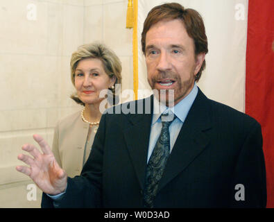 Sen. Kay Baily Hutchison (R-TX) meets with  actor Chuck Norris to discuss the Kick Start program, on Capitol Hill in Washington on May 10, 2006. The Kick Start program is a youth character development program that aims to keep kids off drugs, out of gangs and builds their self confidence through martial arts. (UPI  Photo/Kevin Dietsch) Stock Photo