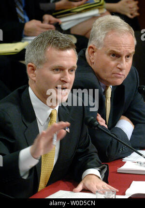 Acting assistant attorney general of the Office of Legal Counsel for the Justice Department Steve Bradbury (L) and Principal deputy general counsel for the Defense Department Daniel Dell'Orto testify before a Senate Judiciary Committee hearing on enemy combatants legal rights at the Guantanamo Bay prison, in Washington on July 11, 2006. (UPI Photo/Kevin Dietsch) Stock Photo