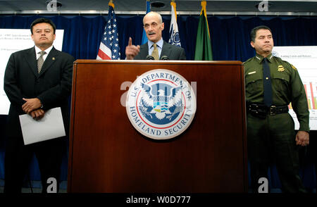 Homeland Security Secretary Michael Chertoff takes a question from a reporter at a briefing on border security, in Washington on August 23, 2006. Chertoff was joined by Immigration Customs Enforcement Acting Director of Detention and Removal John Torres (L) and US Border Patrol Chief David Aguilar.  (UPI Photo/Kevin Dietsch) Stock Photo
