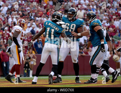 Khalif Barnes of the Jacksonville Jaguars on the sidelines studies