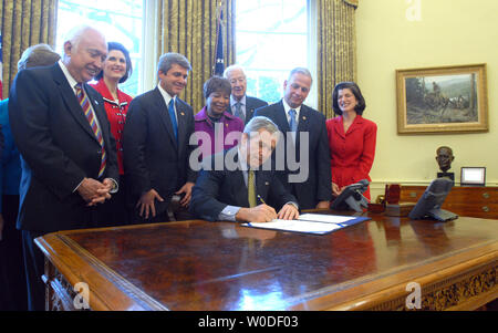 U.S. President George W. Bush signs H.R. 584, the Lyndon Baines Johnson Department of Education Building bill, in the Oval Office of The White House on March 23, 2007.    (UPI Photo/Roger L. Wollenberg) Stock Photo