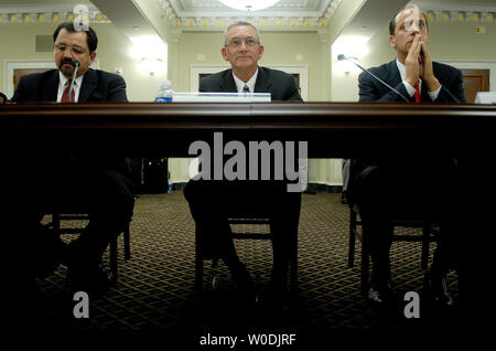Global Security Advisor for Shell International Richard Garcia (L), Senior Vice President of Halliburton Michael Pfister (C) and David Marchick, partner in Covington & Burling, testify before a House Homeland Security Committee hearing on the impact of foreign ownership of American companies, in Washington on May 16, 2007. (UPI Photo/Kevin Dietsch) Stock Photo