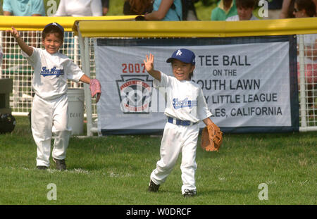 Members of the Wrigley Little League Dodgers of Los Angeles wear