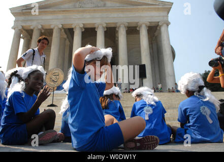 Young children wear Thomas Jefferson style wigs at a ceremony to introduce the new Thomas Jefferson one dollar coin, at the Thomas Jefferson Memorial in Washington on August 15, 2007. The coin is part of a yearly presidential series that will release special commemorative one dollar coins every year until 2012. (UPI Photo/Kevin Dietsch) Stock Photo