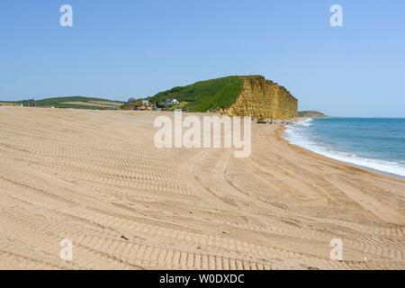 West Bay, Dorset, UK.  27th June 2019. UK Weather.  The main beach is closed at seaside resort of West Bay in Dorset on a day of clear blue skies and scorching hot sunshine.  The main section of the bech has been close for Environment Agency coastal protection works since the beginning of May.  Picture Credit: Graham Hunt/Alamy Live News Stock Photo