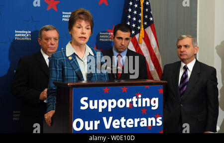 Cheryl Beversdorf of National Coalition for Homeless Veterans, joined by Sen. Richard Durbin, D-IL, Vote Vets Chairman Jon Soltz and Sen. Jack Reed, D-RI, speaks during a news conference calling on President Bush to sign a veterans funding bill on Capitol Hill in Washington on November 2, 2007.    (UPI Photo/Roger L. Wollenberg) Stock Photo