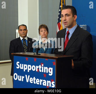 Vote Vets Chairman Jon Soltz, joined by Joseph Violante of Disabled American Vets and Cheryl Beversdorf of National Coalition for Homeless Veterans, speaks during a news conference calling on President Bush to sign a veterans funding bill on Capitol Hill in Washington on November 2, 2007.    (UPI Photo/Roger L. Wollenberg) Stock Photo