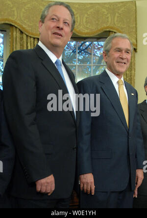 U.S. President George W. Bush (R) is joined by former Vice President Al Gore during a photo-op with recipients of the 2007 Nobel Awards in the Oval Office at the White House in Washington on November 26, 2007. Gore was awarded the Nobel Peace Prize. (UPI Photo/Kevin Dietsch) Stock Photo