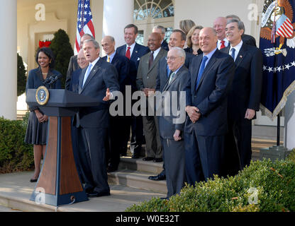 President George W. Bush (C), joined by members of his Cabinet, delivers a statement after meeting with his Cabinet at The White House in Washington on December 14, 2007. (UPI Photo/Kevin Dietsch) Stock Photo