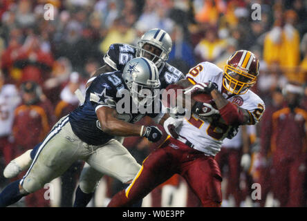 Dallas Cowboys' Roy Williams (31) celebrates with Ken Hamlin after  recovering Chicago Bears running back Cedric Benson's fumble in the third  quarter at Soldier Field in Chicago on September 23, 2007. The