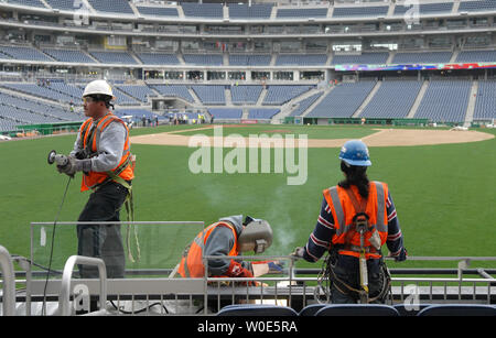 Construction workers put finishing touches on the Washington Nationals new stadium in Washington on March, 4 2008. The Nationals will play their first game in the new stadium on March 30 against the Atlanta Braves. (UPI Photo/Kevin Dietsch) Stock Photo