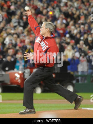 President George W. Bush throws out the first pitch at the Washington Nationals season opening game at their new ballpark in Washington on March 30, 2008.  The Nationals played the Atlanta Braves. (UPI Photo/Kevin Dietsch) Stock Photo