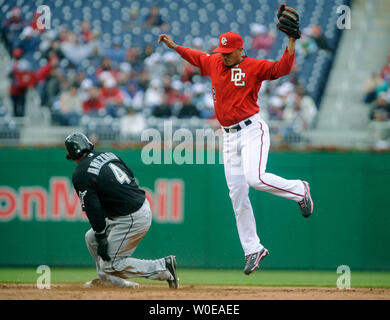 Florida Marlins Alfredo Amezaga safely slides into second as Washington Nationals shortstop Felipe Lopez is unable to get a hold of the ball during the fifth inning at Nationals Park in Washington on May 11, 2008. (UPI Photo/Kevin Dietsch) Stock Photo