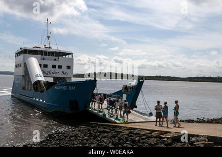 Foot passengers boarding the Kingfisher Bay car ferry at River Heads south of Hervey Bay for Fraser Island in Queensland, Australia. Stock Photo