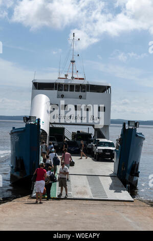 Foot passengers boarding  the Kingfisher Bay car ferry at River Heads south of Hervey Bay for Fraser Island in southern Queensland, Australia. Stock Photo