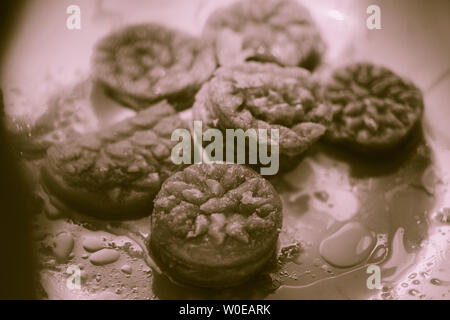 Decorative Deep Fried Crispy rice flower cake nokshi pitha black and white Stock Photo