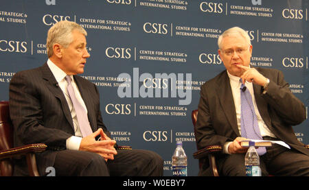 John Hamre (R), President and CEO of the Center for Strategic and International Studies asks a question of Sen. Chuck Hagel (R-NE) speaks during a presentation of his book, 'America: Our Next Chapter: Tough Questions, Straight Answers,' on June 18, 2008 in Washington. (UPI Photo/Jack Hohman) Stock Photo