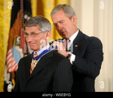 President George W. Bush awards the Presidential Medal of Freedom to Dr. Anthony Fauci for his work in fighting AIDS during a ceremony in the East Room at the White House in Washington on June 19, 2008. (UPI Photo/Kevin Dietsch) Stock Photo