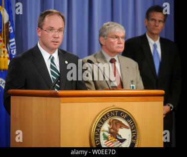 Jeffrey Taylor (L), U.S. Attorney for the District of Columbia, speaks alongside Alexander Lazaroff (C), Chief Postal Inspector, U.S. Postal Inspection Service, and Ken Kole, Assistant U.S. Attorney for the District of Columbia, during a press conference releasing the grad jury documents relating to the anthrax mailings of 2001 at the Justice Departments in Washington on August 6, 2008.  Bruce Edwards Ivins, the FBI's lead suspect in the case, committed suicide last week as investigators were preparing to charge him with murder relating to the attacks. Taylor said the Justice Debarment had eno Stock Photo