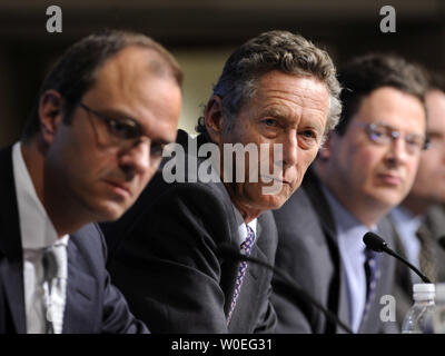Olivier Blanchard (C), the International Monetary Fund (IMF) Economic Counselor, speaks at a media briefing on the World Economic Outlook at the IMF Headquarters in Washington on October 8, 2008. Blanchard said he expects world growth to slow to 3.0 percent in 2009. Blanchard was joined Jorg Decressin (L), head of the European Policies Division at the IMF, and Charles Collyns, Deputy Director to the IMF Economic Counselor. (UPI Photo/Kevin Dietsch) Stock Photo