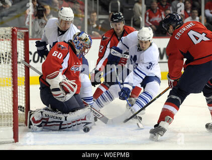 Washington Capitals goalie Jose Theodore stops a shot by Toronto Maple Leafs forward John Mitchell (39) as Washington Capitals defenseman John Erskine (4) defends in the first period at the Verizon Center in Washington on March 5, 2009.     (UPI Photo/Roger L. Wollenberg) Stock Photo