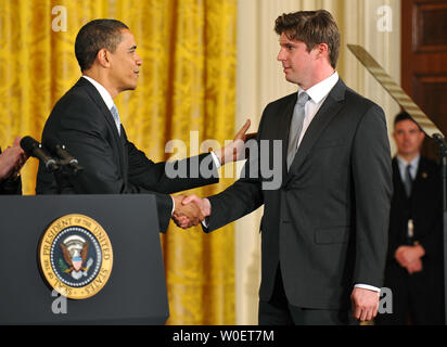 President Barack Obama greets Matthew Reeve, son of actor Christopher Reeve, prior to signing HR 146, which includes the Christopher and Dana Reeve Paralysis Act, which provides paralysis fuding research, during a bill signing ceremony at the White House in Washington on March 30, 2009. Obama was joined by members of the Senate and House.  (UPI Photo/Kevin Dietsch) Stock Photo