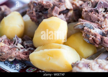 Boiled lamb meat and whole potatoes close up Stock Photo