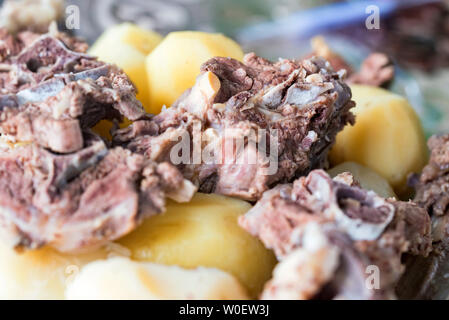 Boiled lamb meat and whole potatoes close up Stock Photo
