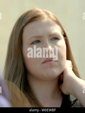 Savana Redding, age 19, is seen in front of the Supreme Court after oral arguments were made in her case in Washington on April 21, 2009. Redding, age 13 at the time, was strip searched at her Arizona school after another student accused her of giving out prescription-strength ibuprofen, the equivalent of two over-the-counter Advils, when she was in eighth grade. No pills were found. The Supreme Court will decide whether the strip search was an invasion of privacy and a violation of the Fourth Amendment.     (UPI Photo/Roger L. Wollenberg) Stock Photo