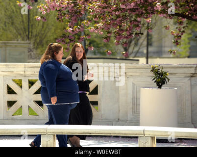 Savana Redding, age 19, (R) walks with her mother April in front of the Supreme Court after oral arguments were made in her case in Washington on April 21, 2009. Redding, age 13 at the time, was strip searched at her Arizona school after another student accused her of giving out prescription-strength ibuprofen, the equivalent of two over-the-counter Advils, when she was in eighth grade. No pills were found. The Supreme Court will decide whether the strip search was an invasion of privacy and a violation of the Fourth Amendment.     (UPI Photo/Roger L. Wollenberg) Stock Photo