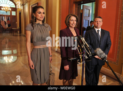 House Speaker Nancy Pelosi (D-CA), King Abdullah II of Jordan and his wife Queen Rania speak to the press prior to a meeting with in the Capitol Building in Washington on April 22, 2009. (UPI Photo/Kevin Dietsch) Stock Photo