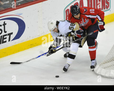 Washington Capitals right wing Matt Bradley and Pittsburgh Penguins defenseman Kris Letang fight for the puck during the first period of game 7 of the Eastern Conference Semifinals at the Verizon Center in Washington on May 13, 2009. (UPI Photo/Kevin Dietsch) Stock Photo