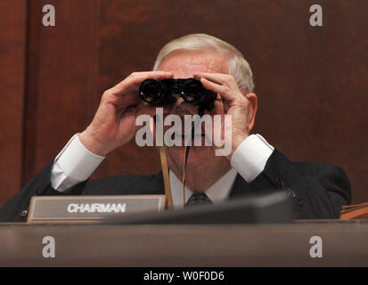 Chairman of the House Armed Services Committee Rep. John Murtha (D-PA) joking uses a pair of binoculars to look at Defense Secretary Robert Gates, Chairman of the Joint Chiefs of Staff Adm. Michael Mullen and Defense Comptroller Robert Hale prior to an oversight hearing on the Defense Department in Washington on May 20, 2009. (UPI Photo/Kevin Dietsch) Stock Photo