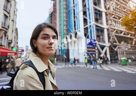 Young girl in front of the Pompidou Center in Paris